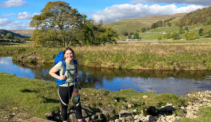 Laura from the Absolute Escapes team walking from Grassington to Buckden