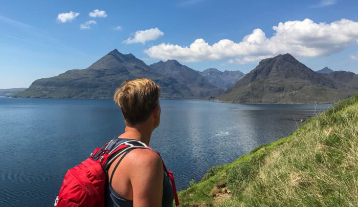 An Absolute Escapes client admiring the views of The Cuillin across Loch Scavaig (credit - Wiki Ulrich)