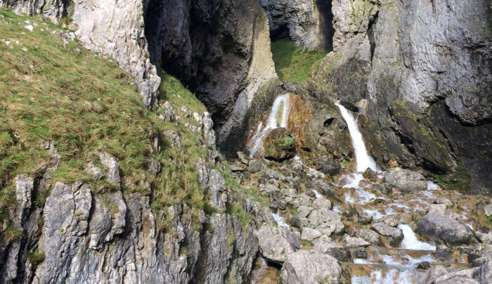 Hiker admiring Gordale Scar