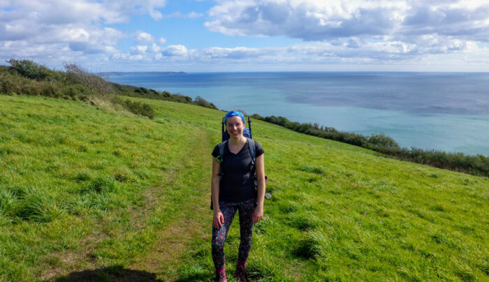 Megan from Absolute Escapes walking towards Rame Head