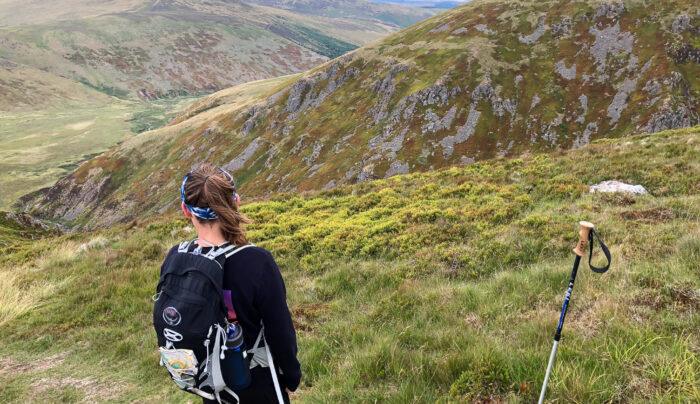 Hiker heading down to the mountain refuge at Auchope Cairn