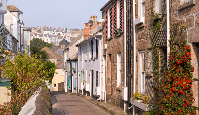 Narrow Cornish lane lined with pretty cottages in the town of St Ives