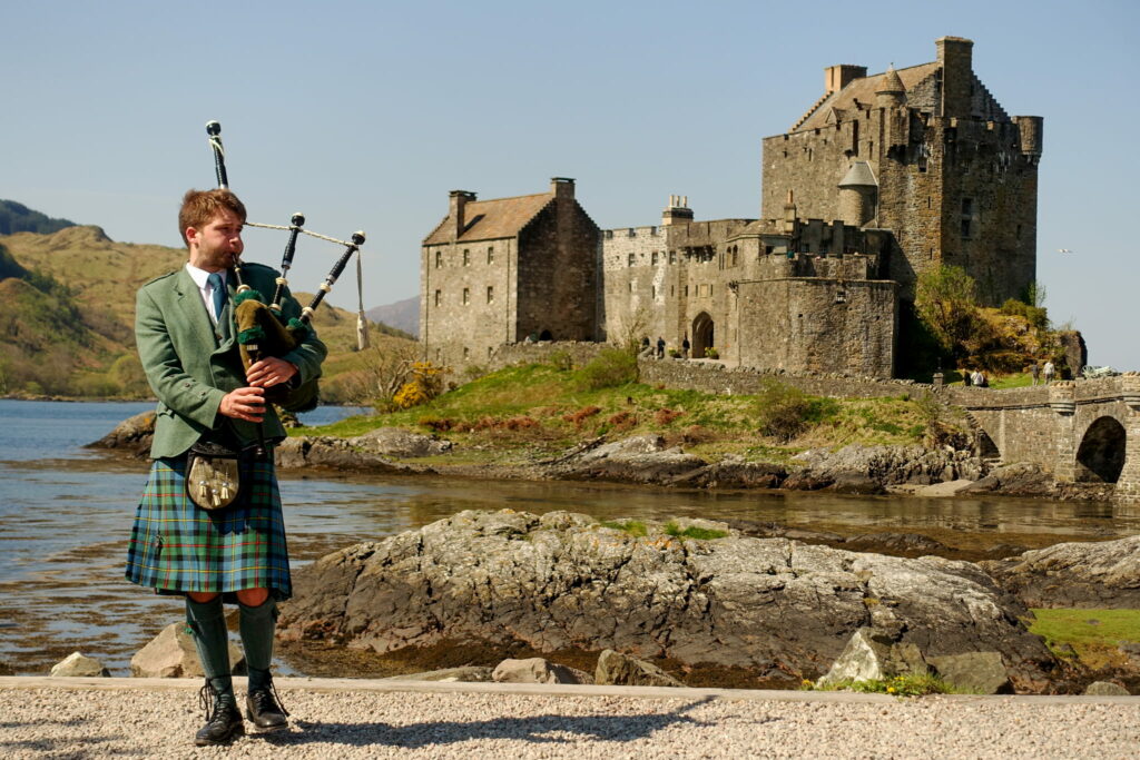 Piper at Eilean Donan Castle by Steve and Jane Gow