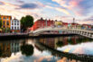 Dublin, Ireland. Night view of famous illuminated Ha'Penny Bridge in Dublin, Ireland at sunset