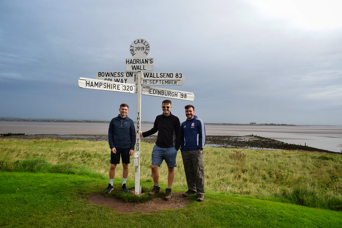 Three walkers by the River Solway on the Hadrian's Wall Path