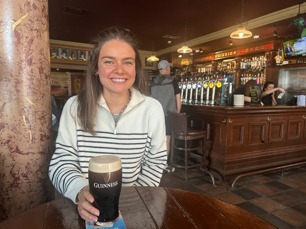 Nairne from Absolute Escapes with a pint of Guinness at McHugh's Bar in Belfast