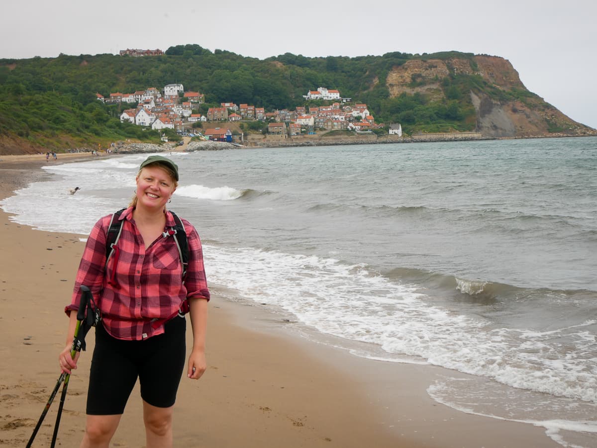 Walker at Runswick Bay in the North York Moors National Park