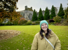 Female standing outside Falkland Palace in Autumn